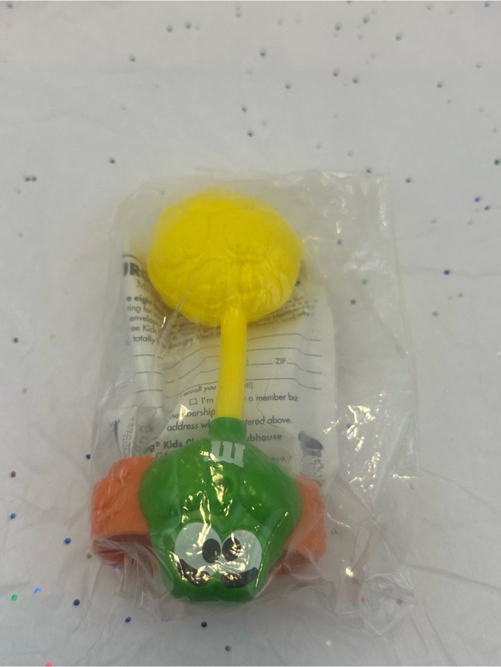 1997 Burger King Green M&M Minis "Secret Swarm" wrist squirt toy.